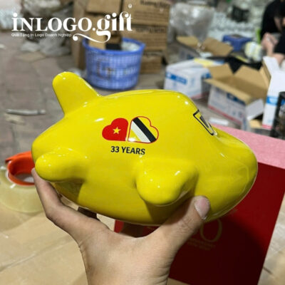 Ống tiết kiệm in logo màu vàng dáng máy bay