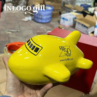 Ống tiết kiệm in logo màu vàng dáng máy bay