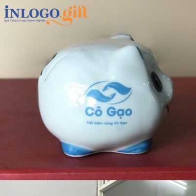 Heo đất in logo màu trắng tai xanh dương kích thước 13x14x14cm HĐ-08