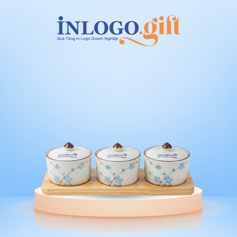 Mẫu bộ 3 hũ mứt in logo dáng tròn màu trắng hoạ tiết hoa đào xanh